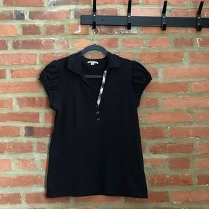 Gently used Burberry black polo with cupped short sleeves.